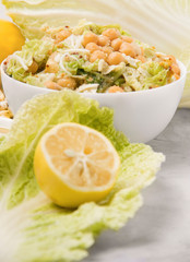 Vegetarian dish. Chickpea salad with cabbage on a light background. Powerful nutrition