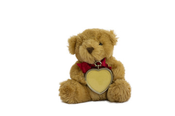 Brown teddy bear and heart sitting isolated on white background