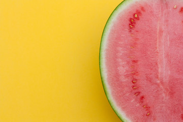 Slice of watermelon on yellow background. 