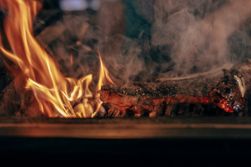 steak is cooking with the fire