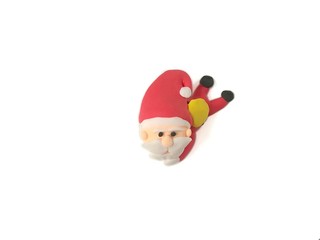 Cute Santa Claus handmade from plasticine clay on white background, beautiful festival are dough
