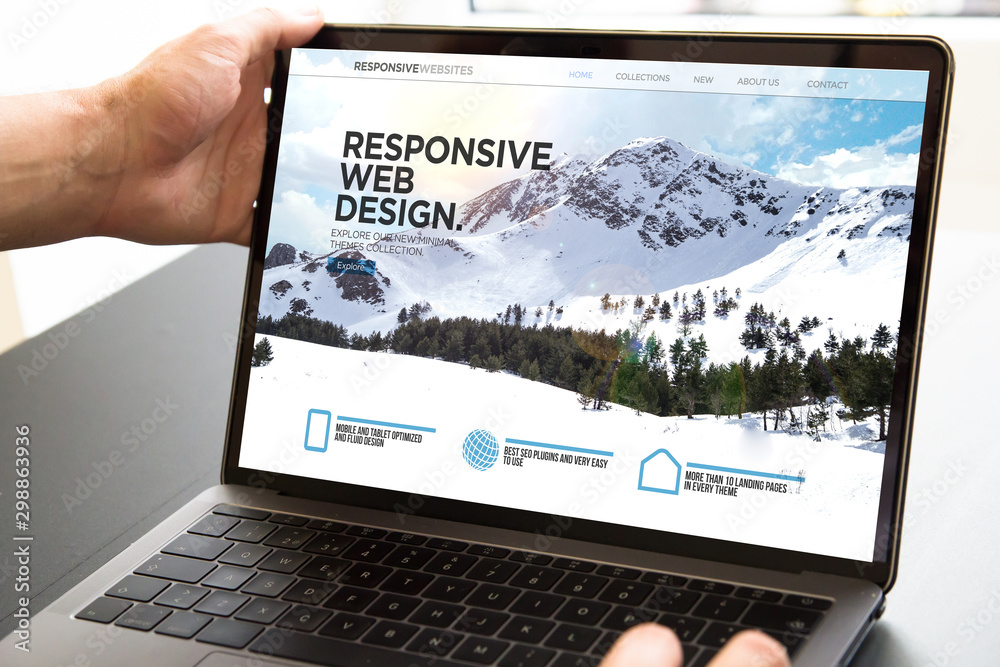 Wall mural user opening laptop showing responsive web design