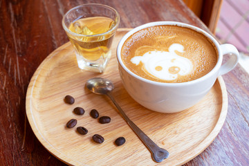 Latte art in a white glass