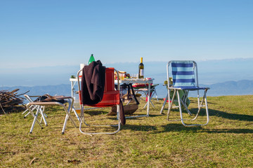 Picnic and camping equipment, table and chairs on the top of the mount