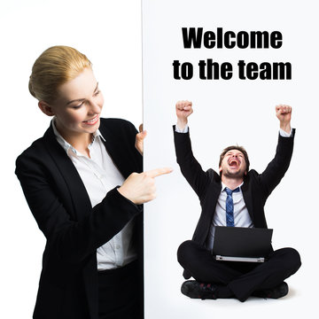 businesswoman holding sign with message "welcome to the team" on white background 