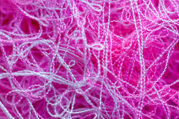Multi-colored tangled threads abstract texture pattern background. Macro shot of colorful needlecraft silk thread ropes.