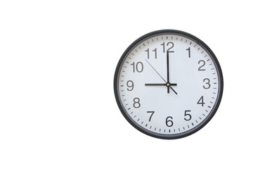 Wall clock hanging on a white background.