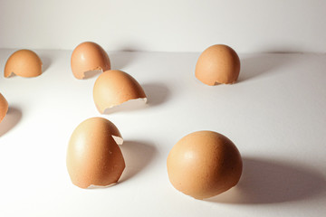 Shadows,cracked eggshells on white background
