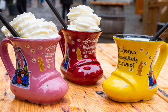 Traditional Christmas alcoholic beverage - Eggnog, also known as milk punch or egg milk punch, in cup in the form of shoe, Aachen, Germany