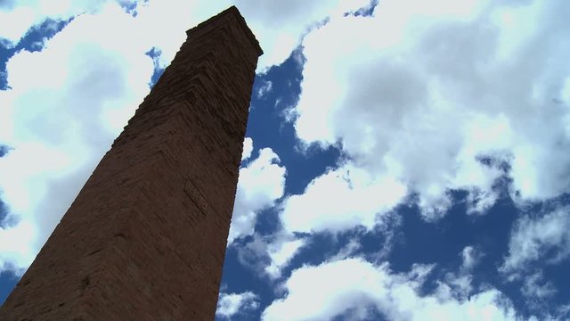 Clouds timelapse with ruin red bricks former mine tower in tne Andes mountains, Bolvia