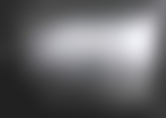 Black metallic defocused background. Steel glare vignette blurred texture. Dark iron empty background. Metal abstract illustration.