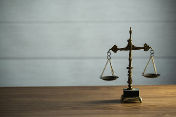 Wooden judge`s gavel.  Themis figurine. The criminal law. Low concept.