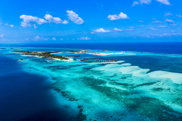 Aerial view, lagoon of Maldives island Olhuveli with water bungalows South Male Atoll, Maldives