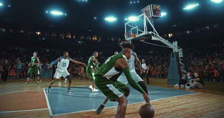 Basketball players on big professional arena during the game. Tense moment of the game. Celebration - Powered by Adobe