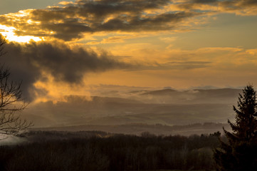 landscape of sunset with cloudy orange sky