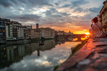Sunset view over Arno River in Florence, Italy. Florence architecture. Many People see the sunset over the Arno river