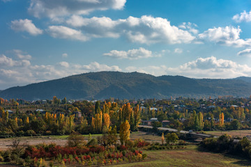 Naklejka premium Small village in mountainous area at autumn season