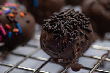 Chocolate donut holes with sprinkles