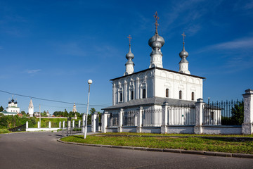 Fototapeta na wymiar Russia, Vladimir Oblast, Suzdal: Panorama view of famous Peter and Paul church next to Intercession Convent with blue sky in the center of one of the oldest Russian towns and Alexandrovsky Convent.