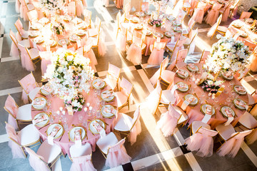 Beautiful dinner table decorated by gold accessories and flowers. Wedding. Decor