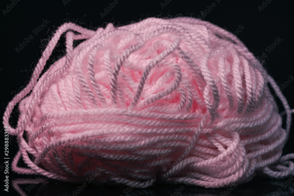 Poster beautiful pink tangle of thread on a dark background texture.