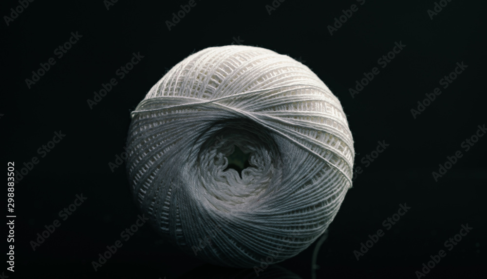 Poster beautiful white tangle of thread on a dark background texture.
