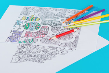 Adult coloring books, with pencils on a table. Time for relieves stress. Modern antistress book for adult and kid