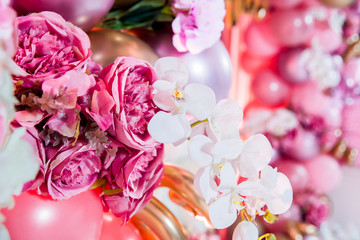 decoration balloons and flowers on pink background