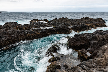 Fototapeta na wymiar Waves and water of coast of Garachico.
