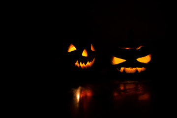Halloween pumpkin head jack lantern in dark background