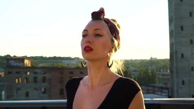 Charming Girl Dancing Waacking On Roof At Sunset