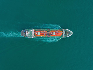 Aerial top view Oil or LPG ship tanker transportation oil or LPG gas from refinery on the sea.
