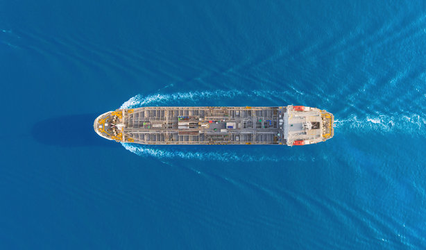 Aerial top view Oil ship tanker full speed for transportation oil from refinery on the sea.