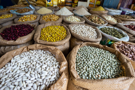 Different kinds of healty grains, seeds, legumes and beans in bulk bags at the market in Ibarra, Ecuador, South America. Organic healthy fresh vegan food.
