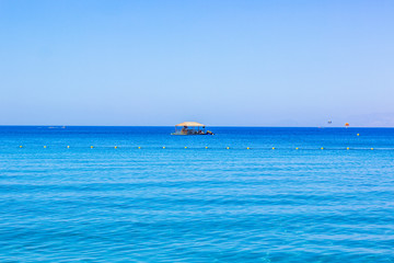 rustic wooden lonely bungalow surrounded by Red sea waters summer vacation relaxation place tropic concept photography with empty background space for copy or your text