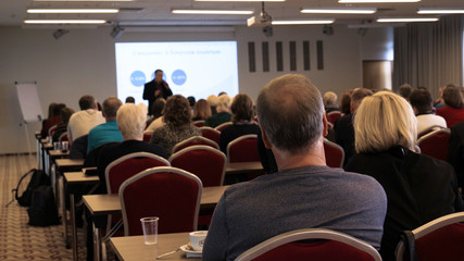Blur of business Conference and Presentation in the blurred background of event concert lighting at conference hall.