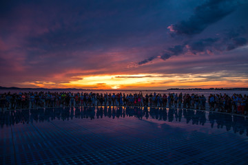 Zadar, Croatia - July, 2019: Greetings to the sun installation in Zadar, people silhouette at sunset © F8  \ Suport Ukraine