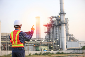 Senior engineer audit job at site line , mid age engineer using laptop computer work at outdoor