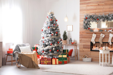 Beautiful Christmas interior of living room with decorated tree
