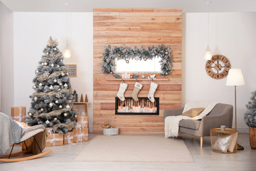 Beautiful interior of living room with decorated Christmas tree