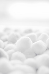 Organic cotton balls background for morning routine, spa cosmetics, hygiene and natural skincare...