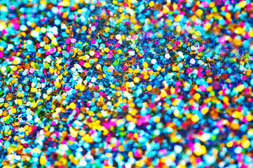 Background from colored confetti. Blur effect on part of the photo