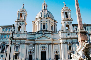 Fototapeta na wymiar The church of Sant'Agnese in Agone by Francesco Borromini, 1653, with the Fountain of the Four Rivers in Piazza Navona, Rome, Italy.