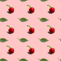 Seamless background with hot red pepper round with green leaf on pinck background. Modern style isometric concept.