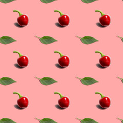Seamless background with hot red pepper round with green leaf on coral background. Modern style isometric concept.
