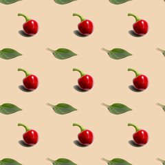 Seamless background with hot red pepper round with green leaf on cream background. Modern style isometric concept.