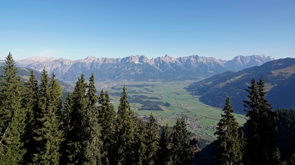 a wonderful sunny day on the mountain with a beautiful view to the alps over the valley