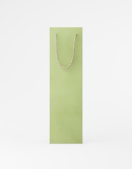 Eco packaging mockup bag kraft paper with handle front side. Tall narrow green template on white background promotional advertising. 3D rendering