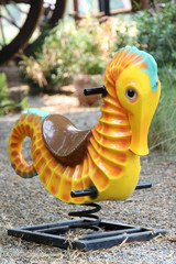Rocking horse in a shaped of sea horse in the park.