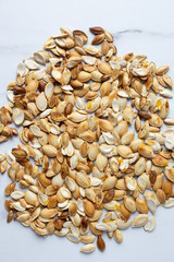 roast Pumpkin seeds background, flat lay
